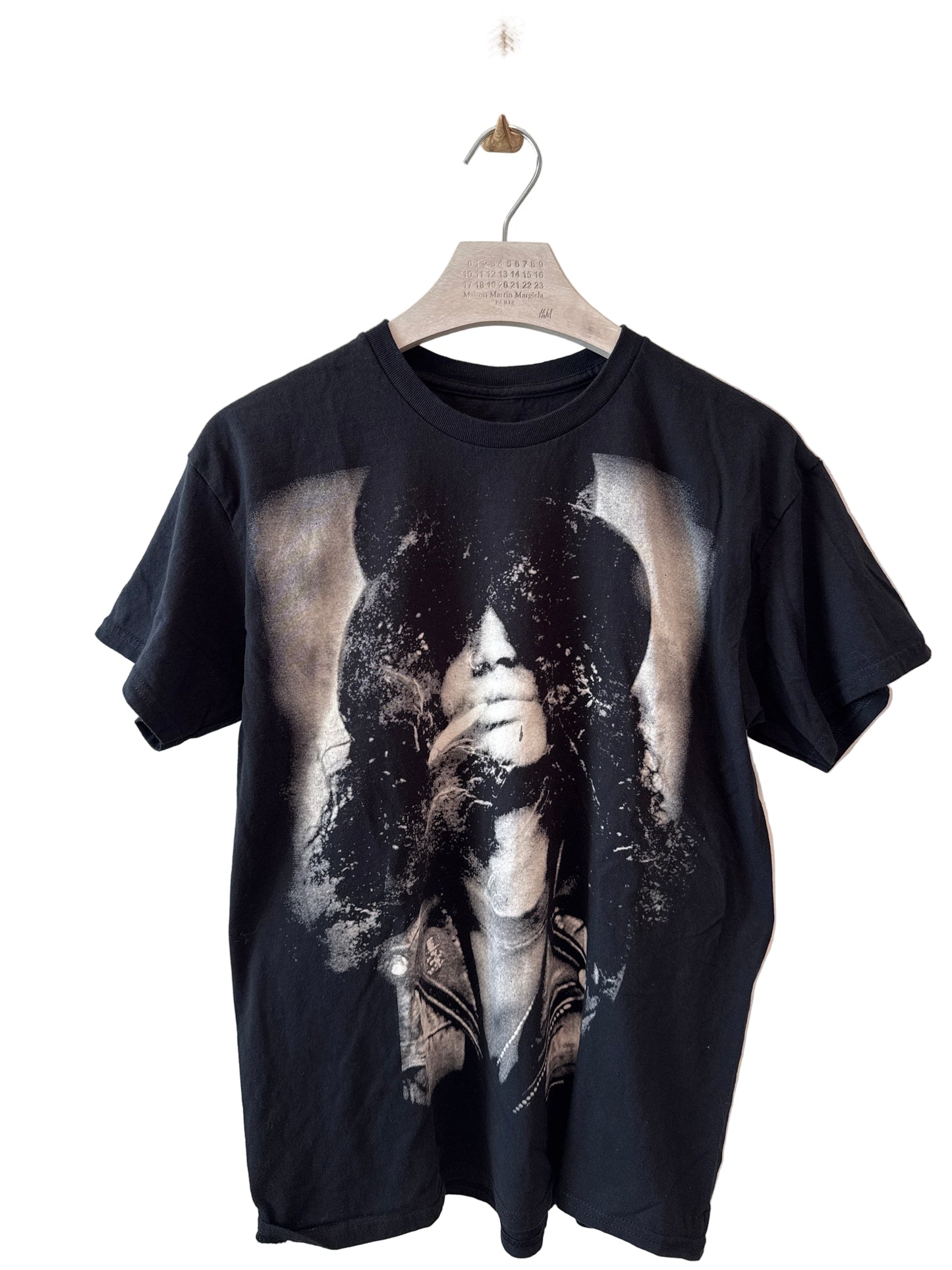 Black t-shirt with a graphic design on a white background