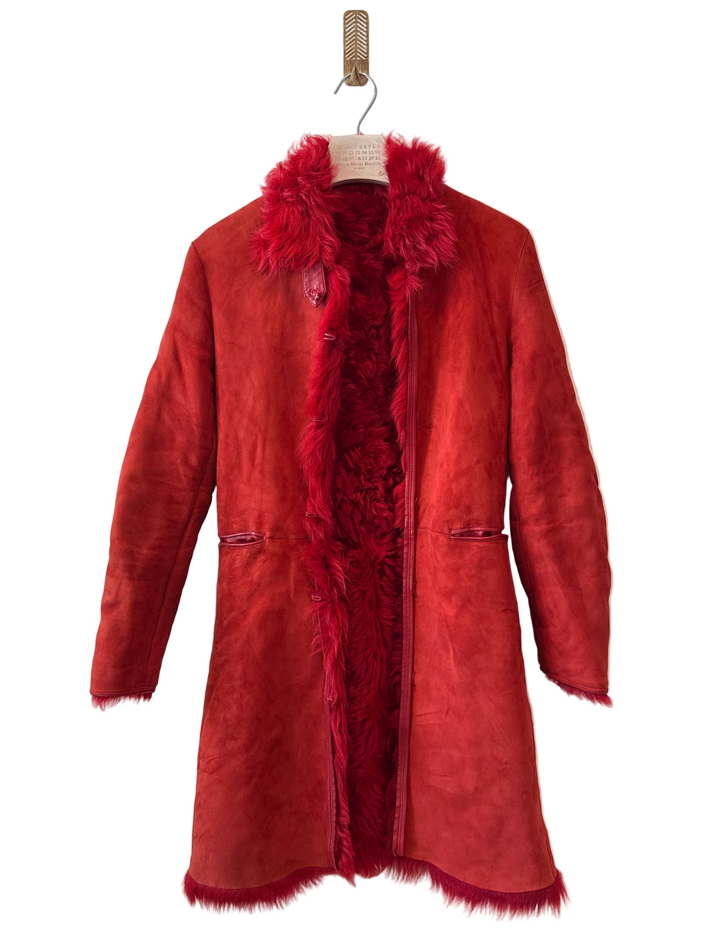 Red jacket with fur trim on a white background